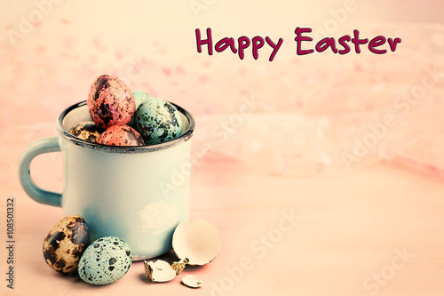 Bird colorful eggs in mug on bright background. Retro stylization