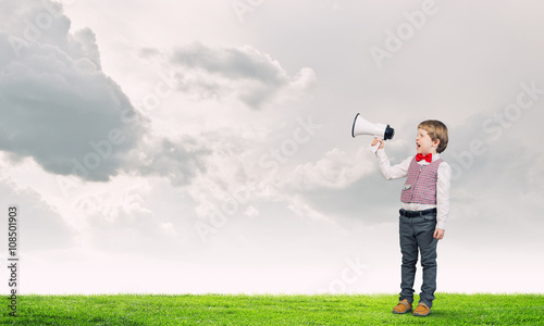 Kid boy with megaphone