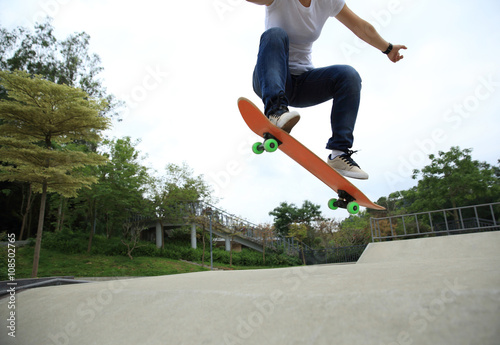 young skateboarder skateboarding at skatepark