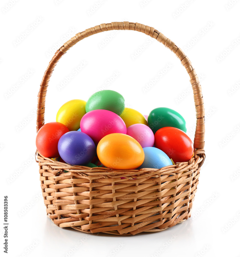 Multicoloured Easter eggs in basket isolated on white Multicoloured Easter eggs in basket isolated on white