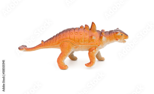 side view orange Pinacosaurus toy on a white background © Freer