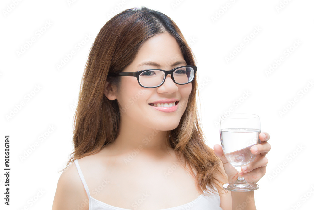 young woman smiling with hand holding a glass of water young woman smiling with hand holding a glass of water