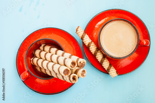 coffee and wafer tubules on a table, selective focus