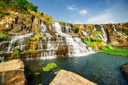 Amazing natural cascading waterfall with crystal clear water photo