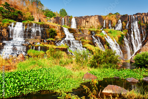 Fototapeta Naklejka Na Ścianę i Meble -  Scenic natural cascading waterfall with crystal water, Vietnam