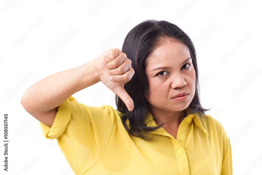 frustrated middle aged woman giving thumb down frustrated middle aged woman giving thumb down
