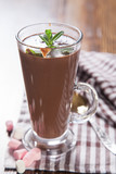 hot chocolate with a souffle in a glass on a table, selective focus
