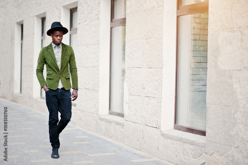 Fashion portrait of black african american man on green velvet j Fashion portrait of black african american man on green velvet j