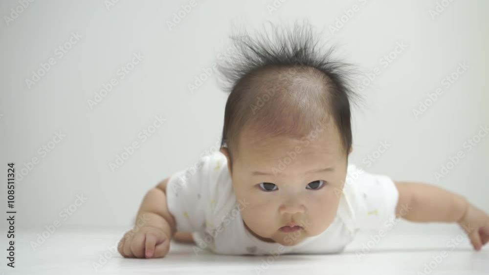 Asian chinese baby smiling happy on a white background Asian chinese baby smiling happy on a white background