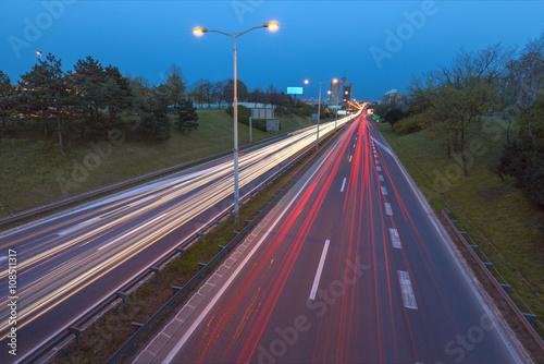 Blue hour photo on city highway with light trails