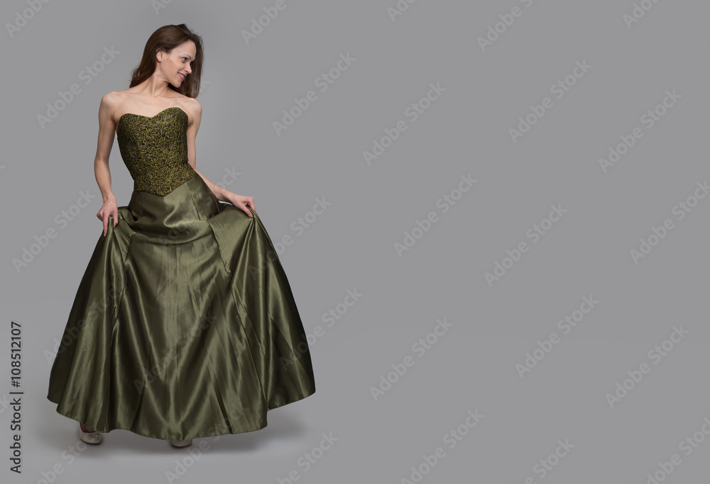 Young brunette lady in green dress
