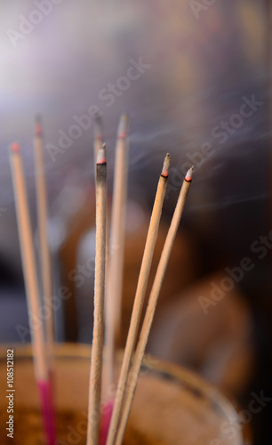 Burning Incense sticks Buddha Statue
