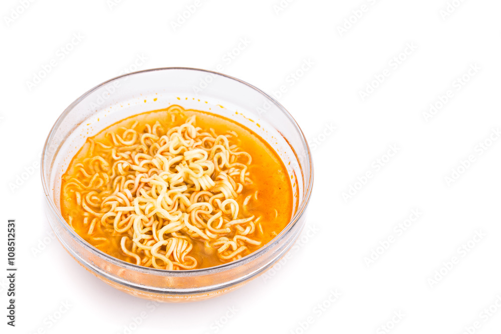 Bowl of convenient but unhealthy instant noodle with sodium flavored soup on white background Bowl of convenient but unhealthy instant noodle with sodium flavored soup on white background