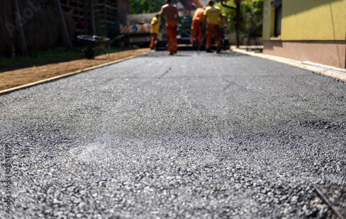 Wallpaper Mural Team of Workers making and constructing asphalt road constructio Torontodigital.ca
