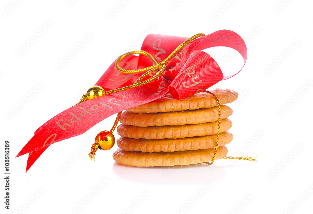Festive wrapped rings biscuits pile isolated on a white backgrou