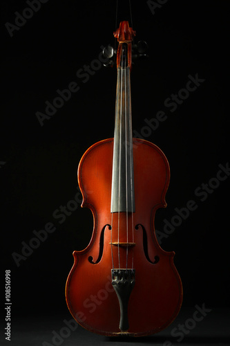 beautiful old violin on a black background