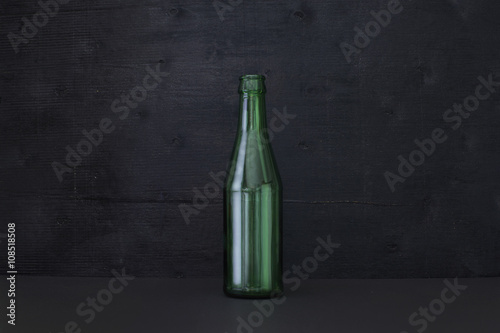blank green botles on black color background