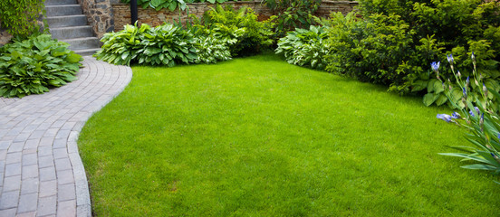 Leinwandbilder Pistache Garden  path with grass  © Andrey Volokhatiuk