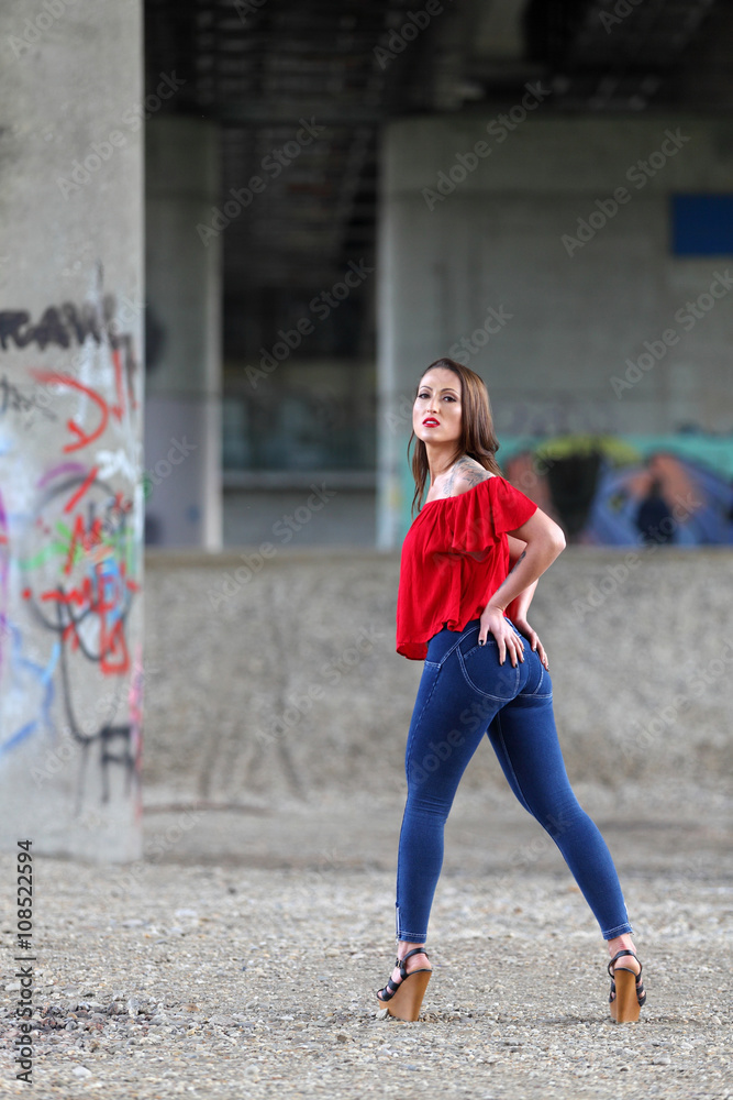 Sexy fitness girl posing in tight jeans Stock Photo | Adobe Stock