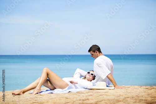 Happy couple on the beach © Bluehousestudio