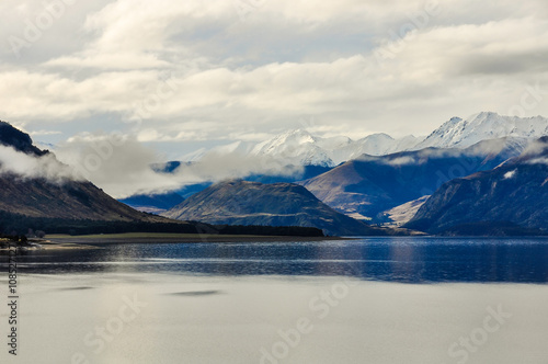 Lake and snowy peaks near Wanaka in Southern Lakes, New Zealand