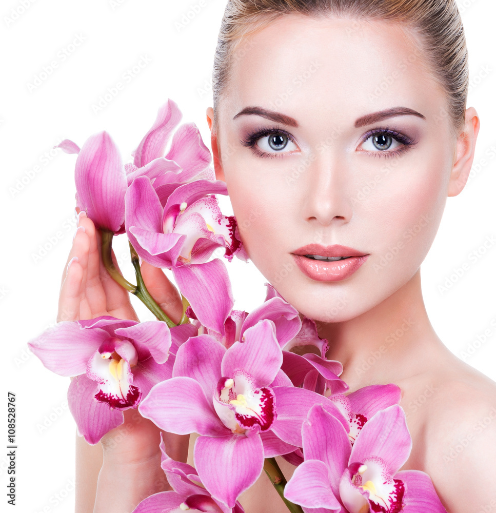 Portrait of beautiful woman with a pink flowers Portrait of beautiful woman with a pink flowers