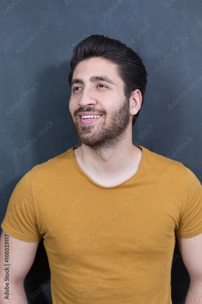 Attractive young man against blackboard. Attractive young man against blackboard.