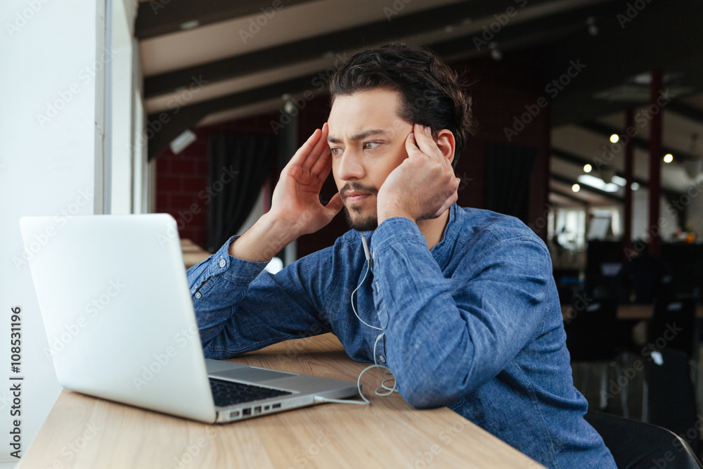 Man thinking about something in office Man thinking about something in office