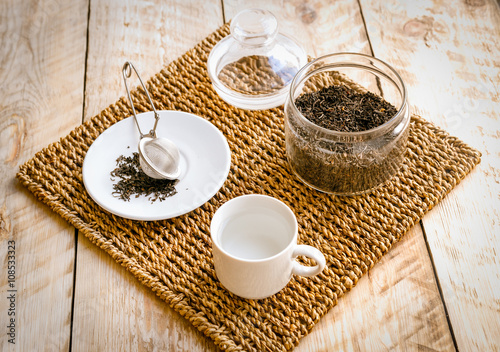 Tea on wicker mat at home wodden table backround