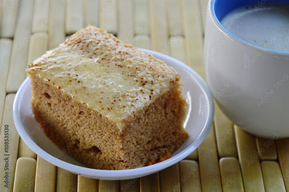 cake and milk coffee on bamboo plate cake and milk coffee on bamboo plate
