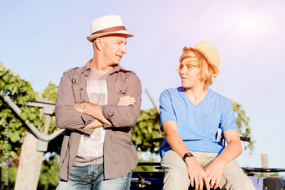Fototapeta premium Father and son in vineyard