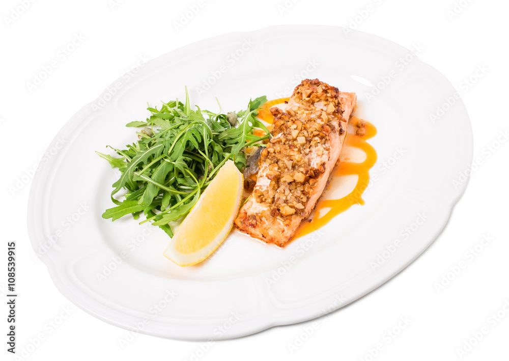 Baked salmon fillet with walnuts and arugula. Baked salmon fillet with walnuts and arugula.
