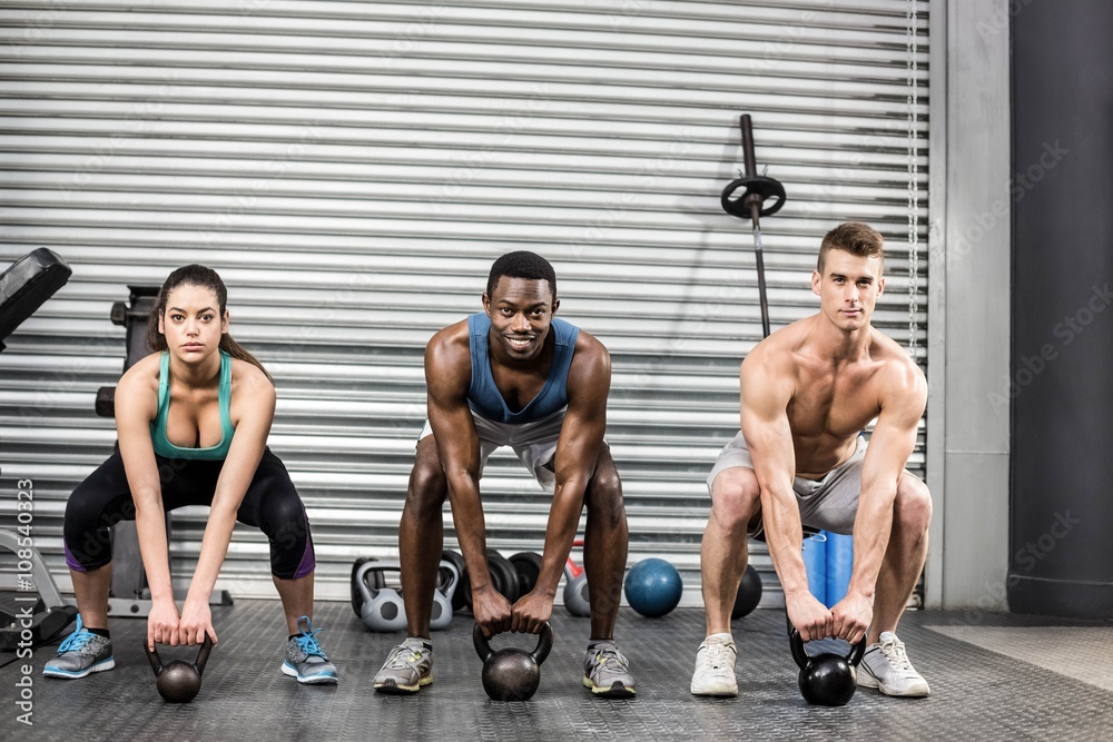 Naklejka premium Fit people lifting dumbbells