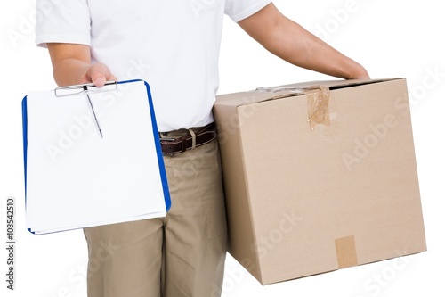 Delivery man with cardboard box and clipboard