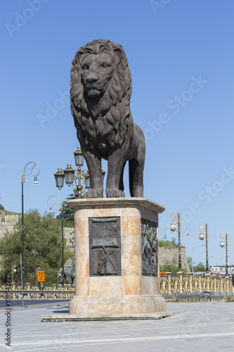 Lion sculpture on the western side of the Goce Delcev bridge over the river Vardar. photo