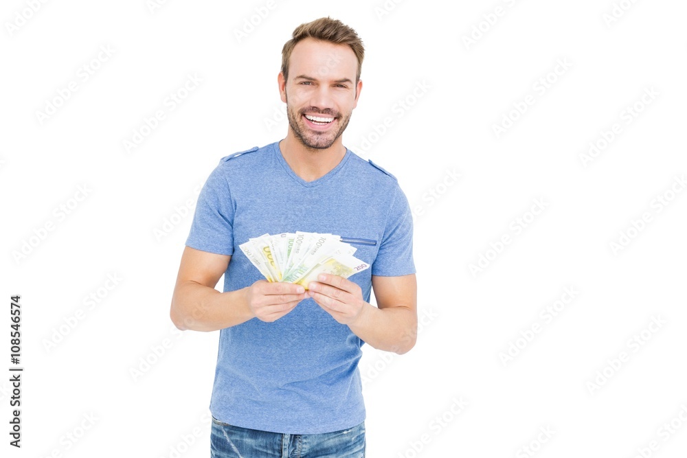 Young man counting currency notes Young man counting currency notes