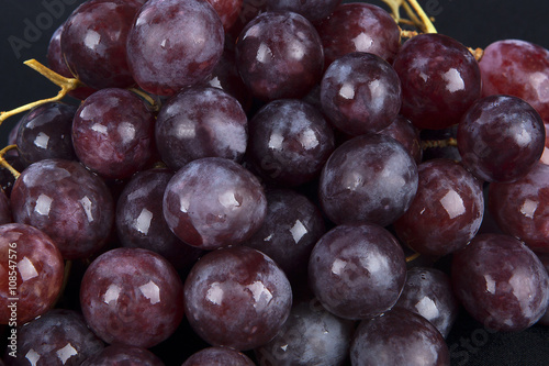Red grape with water drops, closeup background
