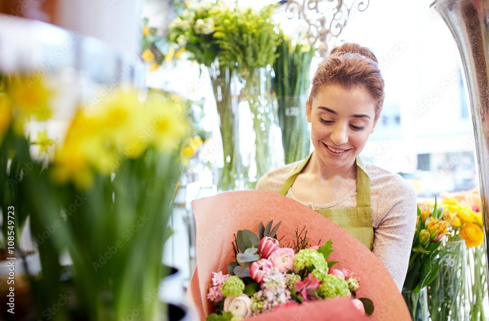 smiling florist woman with bunch at flower shop smiling florist woman with bunch at flower shop