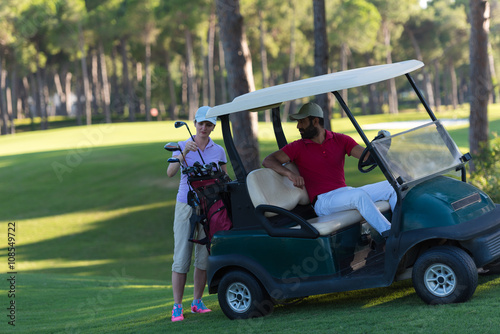 couple in buggy on golf course © .shock