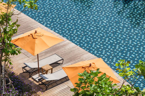 swimming pool  with sunbeds