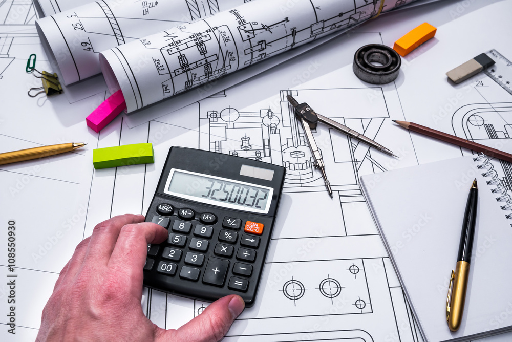 technical drawing and tools in hand technical drawing and tools in hand
