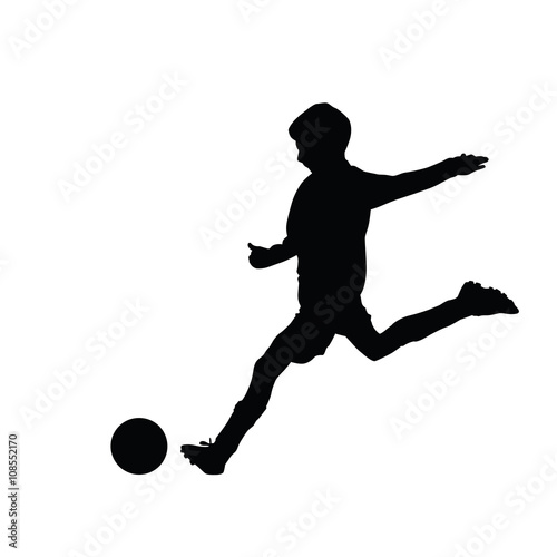 Young soccer player kicking a ball, isolated vector silhouette f
