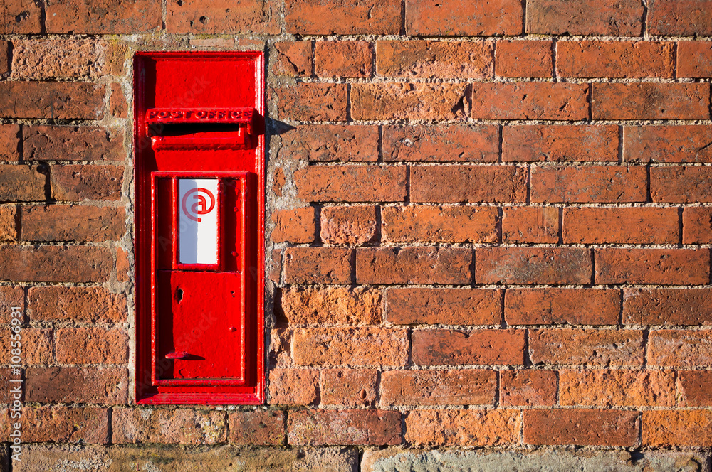 Red British mailbox with email sign on it Red British mailbox with email sign on it