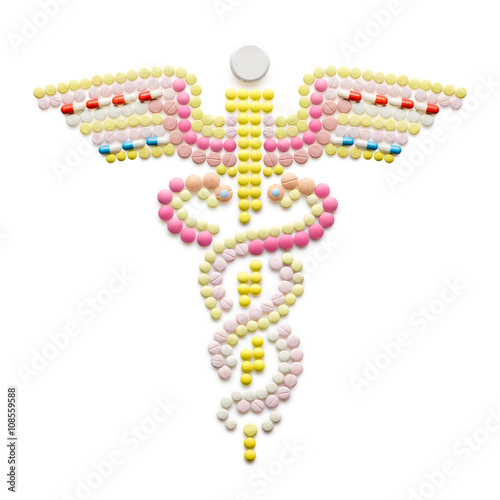 Around a winged rod / Creative medicine and  concept made of drugs and pills, isolated on white. Caduceus medical symbol and symbol of commerce featuring intertwined snakes around a winged rod.