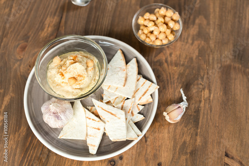 Healthy Homemade Creamy Hummus with Olive Oil and Chips