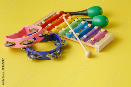 Fotografía Musical instruments collection on yellow background