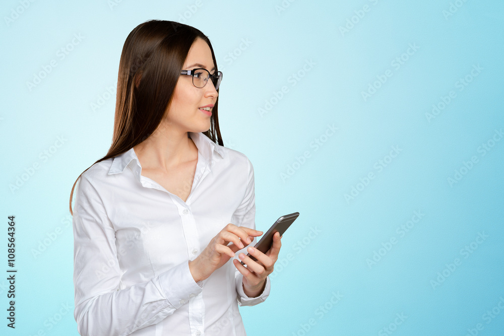 Young, confident, successful and beautiful business woman with the mobile phone isolated Young, confident, successful and beautiful business woman with the mobile phone isolated