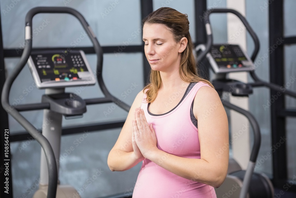 Peaceful pregnant woman with hands together Peaceful pregnant woman with hands together