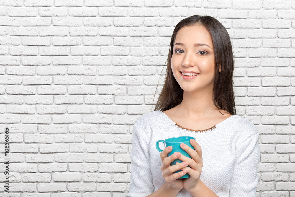 Portrait of young woman having coffee