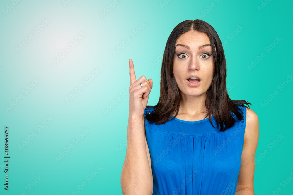 Beautiful happy smiling woman pointing up Beautiful happy smiling woman pointing up